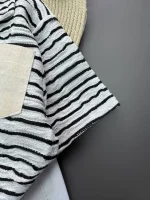 نمای نزدیک از آستین شومیز ژاکارد رنگ مشکی