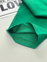 نمای نزدیک از داخل شلوارک تاپ شلوارک یقه دار کارتر رنگ یشمی